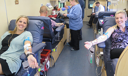 Women giving blood at Select Medical blood drive with Central Penn Blood Bank