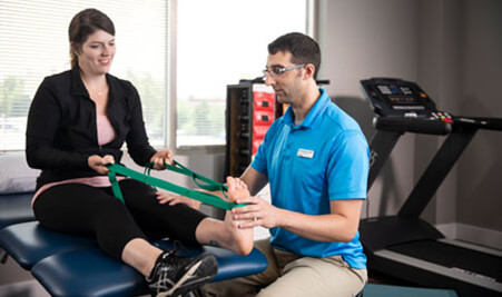 Physical Therapist working with a patient